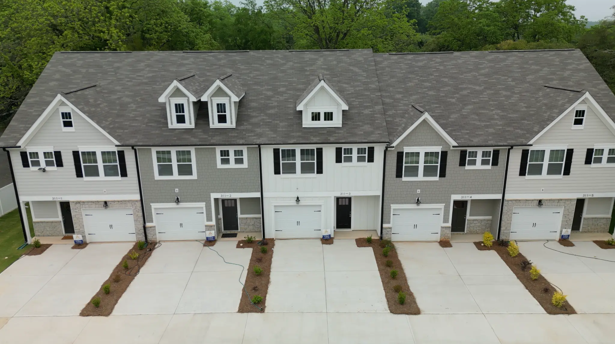 Aerial view of all 5 townhomes from the front