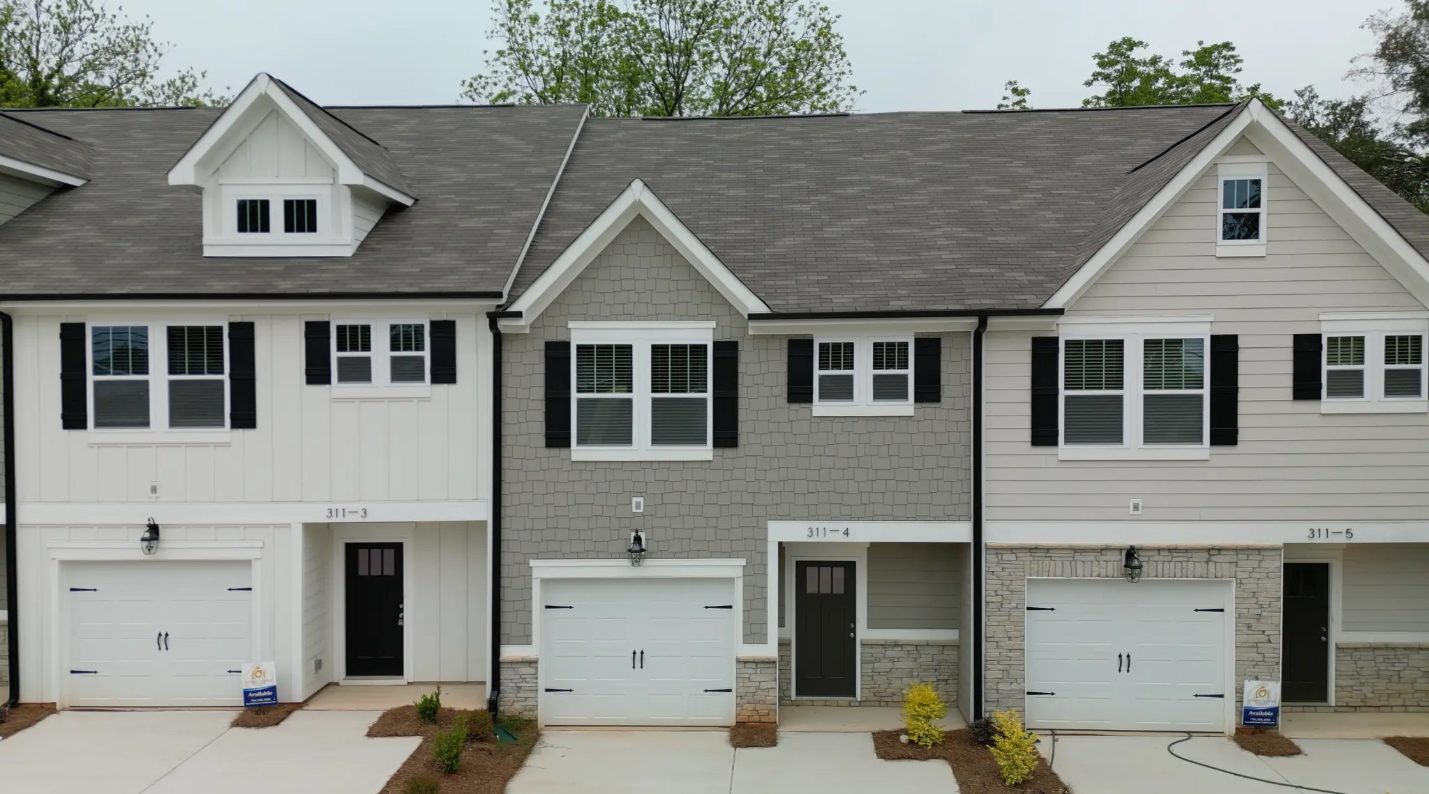 Close-up of townhome facades showing units 3-5